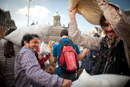 Amsterdam, The Netherlands, Noord Holland - Saturday, April 5 2014 - Pillow Fight on Dam Squareのeditorial素材