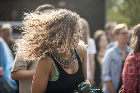 Amsterdam, The Netherlands - July, 5 2015: audience dancing during the concert of Tunisian band Bargou 08 at Amsterdam Roots Open Air, cultural festival held in Park Frankendael on 05/07/2015のeditorial素材