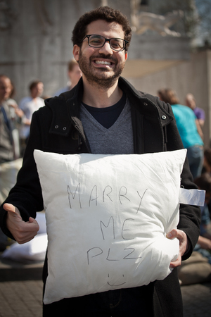Amsterdam, The Netherlands, Noord Holland - Saturday, April 5 2014 - Pillow Fight on Dam Squareのeditorial素材