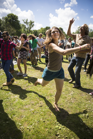 Amsterdam, The Netherlands - July, 3 2016: girl dancing at concert of alternative Electro-Hip Hop Moroccan band N3rdistan at Amsterdam Roots Open Air, free public cultural festival held in Oosterparkのeditorial素材