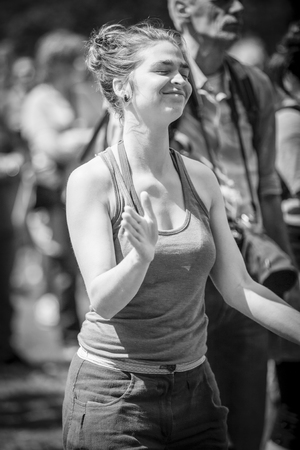 Amsterdam, The Netherlands - July, 3 2016: girl dancing at concert of alternative Electro-Hip Hop Moroccan band N3rdistan at Amsterdam Roots Open Air, free public cultural festival held in Oosterparkのeditorial素材