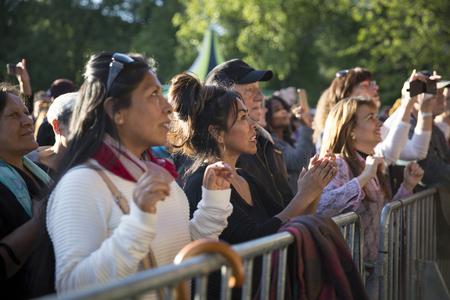 Amsterdam, The Netherlands - July, 3 2016: audience of fans cheering at concert of Cuban band Elito Reve y su Charangon at Amsterdam Roots Open Air, free public cultural festival held in Oosterparkのeditorial素材