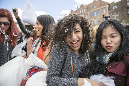 Amsterdam, The Netherlands, Noord Holland - Saturday, April 4 2015 - Pillow Fight on Dam Square as part of the international pillow fight day held in several cities in the worldのeditorial素材