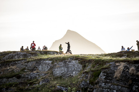 Traena, Norway - July 11 2014: people watching the concert of the Norwegian band Ida Maria from the top of the hill  at the Traenafestival, music festival taking place on the small island of Traenaのeditorial素材