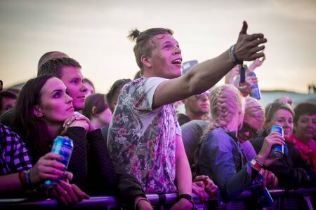 Traena, Norway - July 11 2014: people watching the concert of the Swedish pop-techno band Den...
