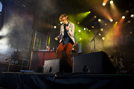 Traena, Norway - July 11 2014: during the concert of the Norwegian singer and guitarist Erlend Oyefeaturing the Icelandic band Hjalmarat the Traenafestival, music festival taking place on the small island of Traenaのeditorial素材