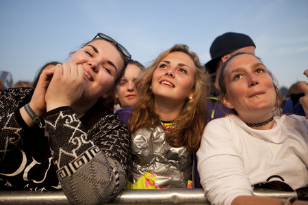 Traena, Norway - July 11 2014: people watching the concert of the Swedish pop-techno band Den Svenska Bjornstammen at the Traenafestival, music festival taking place on the small island of Traenaのeditorial素材