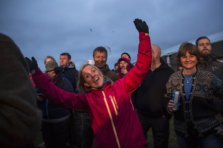Traena, Norway - July 9 2015: fans cheering with arms up at concert of Norwegian rock band OnklP & De Fjerne Slektningene at Traenafestival, music festival taking place on the small island of Traenaのeditorial素材
