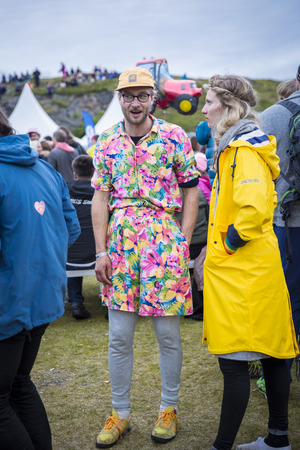 Traena, Norway - July 9 2016: man with a dress at Traenafestival, music festival taking place on the small island of Traenaのeditorial素材