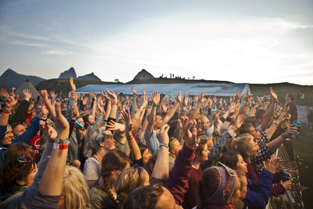Traena, Norway - July 11 2014: people watching the concert of the Swedish pop-techno band Den Svenska Bjornstammen at the Traenafestival, music festival taking place on the small island of Traenaのeditorial素材