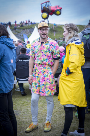 Traena, Norway - July 9 2016: man with a dress at Traenafestival, music festival taking place on the small island of Traenaのeditorial素材