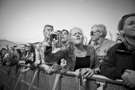 Traena, Norway - July 11 2014: people watching the concert of the Swedish pop-techno band Den Svenska Bjornstammen at the Traenafestival, music festival taking place on the small island of Traenaのeditorial素材