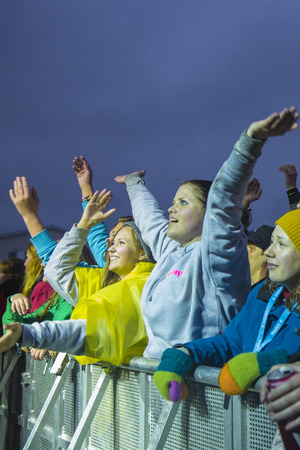 Traena, Norway - July 9 2015: audience cheering, clapping, with arms in the air concert of Swedish rock band Movits! at the Traenafestival, music festival taking place on the small island of Traenaのeditorial素材
