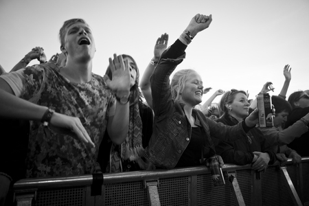 Traena, Norway - July 11 2014: people watching the concert of the Swedish pop-techno band Den...