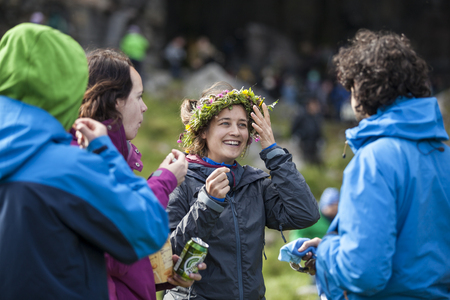 Traena, Norway - July 11 2015: audience at concert of Norwegian singer Anneli Drecker in Kirkehelleren cathedral cave on Sanna Island, at Traenafestival, music festival taking place on the small island of Traenaのeditorial素材