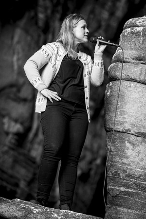 Traena, Norway - July 11 2015: concert of Norwegian singer Anneli Drecker at cathedral cave Kirkehelleren on Sanna Island, at Traenafestival, music festival taking place on the small island of Traena.のeditorial素材