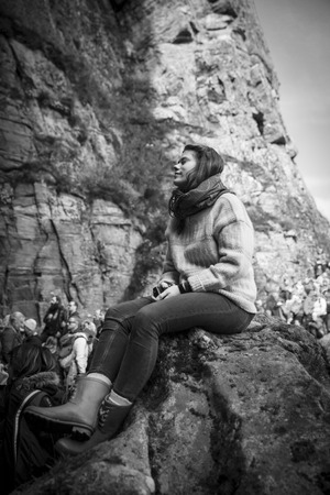 Traena, Norway - July 11 2015: audience at concert of Norwegian singer Anneli Drecker in Kirkehelleren cathedral cave on Sanna Island, at Traenafestival, music festival taking place on the small island of Traenaのeditorial素材