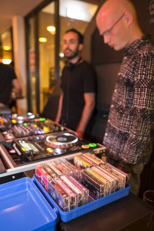 Amsterdam, The Netherlands - August 20 2016: the DJ is using old fashion tape at the \opening party of World Cinema Amsterdam festival at Rialto Cinema, a world film festival held from 18 to 27/08/2016のeditorial素材