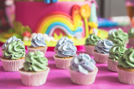 Colorful delicious tasty cupcakes for a birthday partyの写真素材