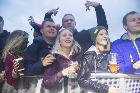 Traena, Norway - July 6 2017: audience cheering, clapping and dancing at concert of Norwegian punk...
