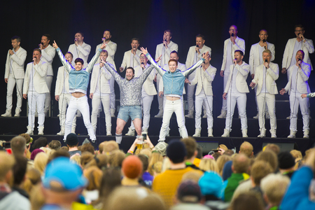 Traena, Norway - July 7 2017: concert of Norwegian gay choir Oslo Fagottkor at Traenafestival, music festival taking place on the small island of Traenaのeditorial素材