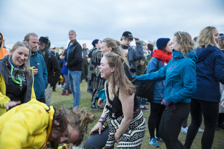 Traena, Norway - July 7 2017: young people dancing in the audience during concert of Norwegian rap...
