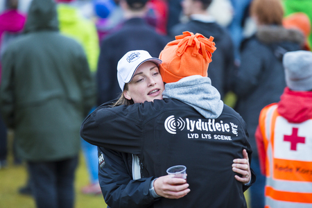 Traena, Norway - July 6 2017: man and woman hugging in the audience at concert of Norwegian punk rock band Honningbarna at Traenafestival, music festival taking place on the small island of Traenaのeditorial素材