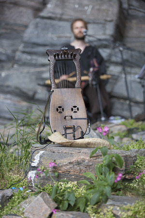 Traena, Norway - July 8 2017: concert of Norwegian band Wardruna at cathedral cave Kirkehelleren on Sanna Island, at Traenafestival, music festival taking place on the small island of Traena.のeditorial素材