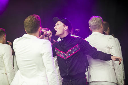 Traena, Norway - July 7 2017: concert of Norwegian gay choir Oslo Fagottkor at Traenafestival, music festival taking place on the small island of Traenaのeditorial素材