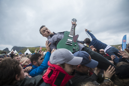 Traena, Norway - July 6 2017: singer of Norwegian punk rock band Honningbarna crowd surfing at Traenafestival, music festival taking place on the small island of Traenaのeditorial素材