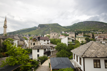 View over the old town of Mostar with minaret of Koski Mehmed Pasha Mosque, Bosnia and Herzegovinaの写真素材