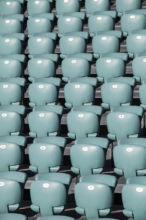 Close up on regular rows of fold-up seatsの写真素材