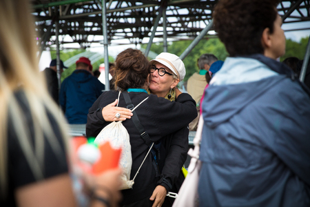 Nyon, Switzerland - 27 July 2019 : 2 women are hugging to greet each otherのeditorial素材