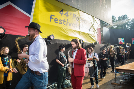 Nyon, Switzerland - 27 July 2019 :  concert of Swiss pop singer Stephan Eicher & Traktorkestar, the muscion of the orchestra are coming on stage from the sideのeditorial素材