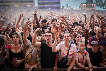 Nyon, Switzerland - 26 July 2019 :  crazy crowd of young poeple cheering and dancing at concert of Congolese-Belgian rap singer Damsoのeditorial素材