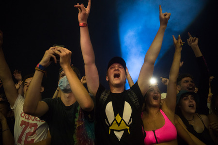 Nyon, Switzerland - 25 July 2019 :  young people in the audien cheering up arms up in the air in front of concert of French rap singer Moha la Squaleのeditorial素材