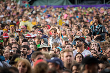 Nyon, Switzerland - 26 July 2019 : audience with crowd of young boys and girls, kids and teenagers at concert of Belgian pop singer Angele.のeditorial素材