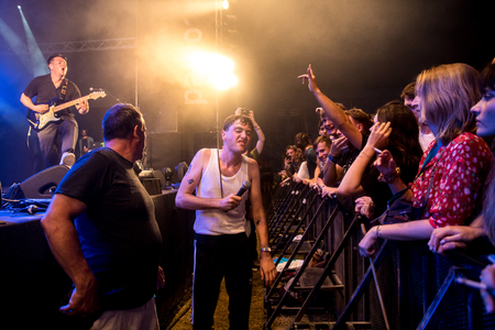 Nyon, Switzerland - 25 July 2019 :  concert of  British punk rock band Life, singer is down in the pit singing with the audienceのeditorial素材