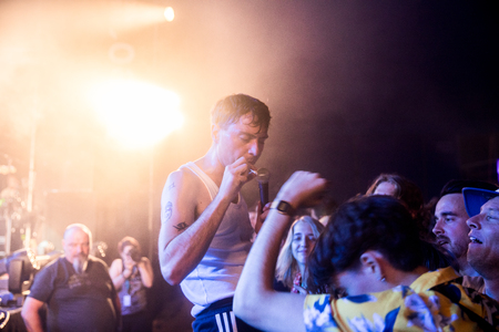 Nyon, Switzerland - 25 July 2019 :  concert of  British punk rock band Life, singer is down in the pit singing with the audienceのeditorial素材