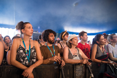 Nyon, Switzerland - 24 July 2019 : young people cheering in the audience at concert of Belgian indie rock singer Tamino at paleo festivalのeditorial素材