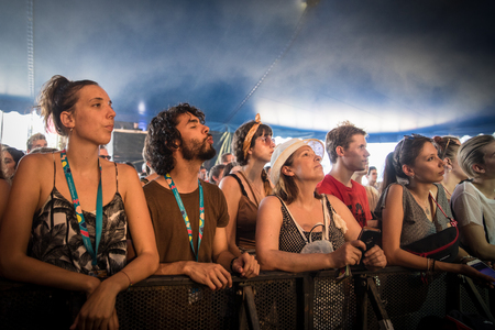 Nyon, Switzerland - 24 July 2019 : young people cheering in the audience at concert of Belgian indie rock singer Tamino at paleo festivalのeditorial素材