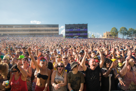 Nyon, Switzerland - 23 July 2019: Audience crowd cheering in front of concert of Canadian rock band from Quebec Les Cowboys Fringants at Paleo Festivalのeditorial素材