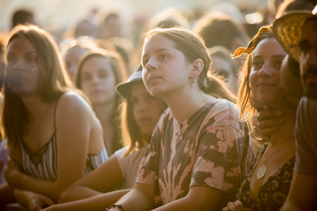 Nyon, Switzerland - 23 July 2019 : group of girls in the audience crowed cheering during concert of Australian singer-songwriter and multi-instrumentalist Tash Sultana at Paleo Festivalのeditorial素材