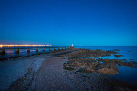 Entrance of Les Sables D'Olonne harbour taken from La Chaume, with it piers and lighthouse at...