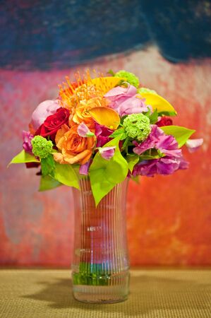 A bridal bouquet in front of a color paintingの写真素材