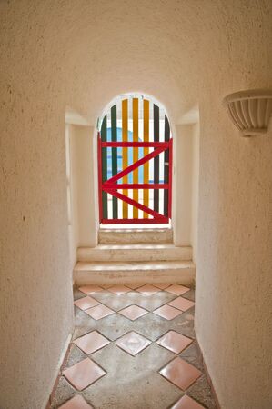 A color full wooden gate viewed from inside a hall wayの写真素材
