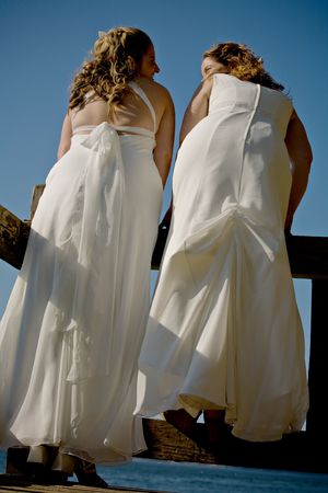 Newly wed females looking at each otherの写真素材