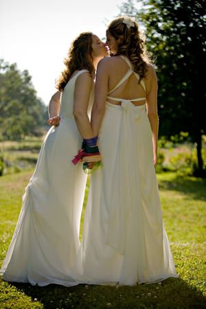Newly wed females kissing each otherの写真素材