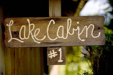 A wooden sign of lake cabin oneの写真素材