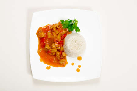 Chicken in sweet and sour sauce with pineapple and riceの写真素材